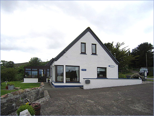 The house at Carrick Bed and Breakfast in Broadford, seen from its garden.